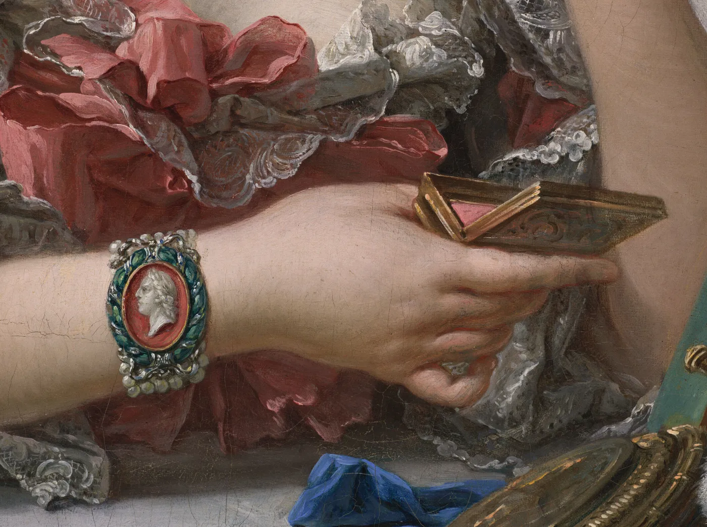 Detail of Boucher's portrait, c. 1750: a hand holding a small mirror